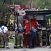 Ann Arbor firefighters navigate an 1100-pound door from a truck as they set up obstacles for training at Parkhurst Apartments on Wednesday morning. The complex is scheduled to be demolished and offers a good training ground for the firefighters.  Melanie Maxwell I AnnArbor.com 